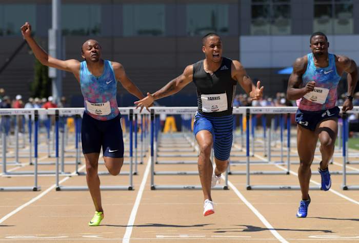 Sacramento, CA, USA; Aleec Harris (center) celebrates after defeating Aries Merritt (left) to win the 110m hurdles, 13.24 to 13.31, during the USA Track and Field Championships at Hornet Stadium. David Oliver (right) was fifth in 13.51. Mandatory Credit: Kirby Lee